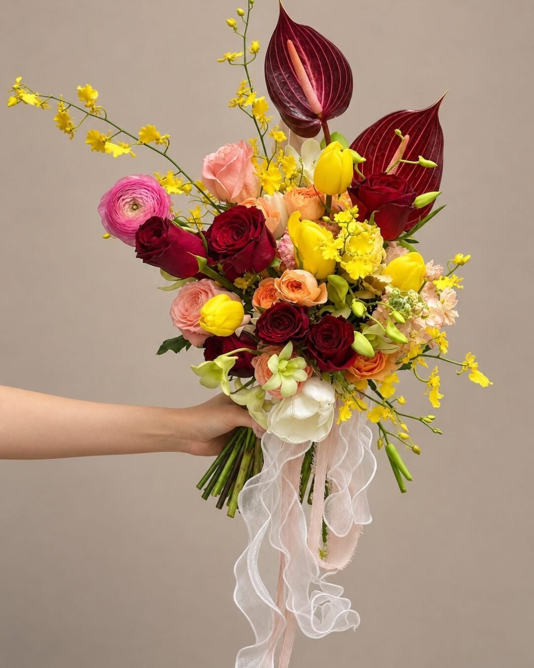 Mae dramatic · asymmetrical bridal bouquet in merlot, crimson, butter yellow, blush and ivory