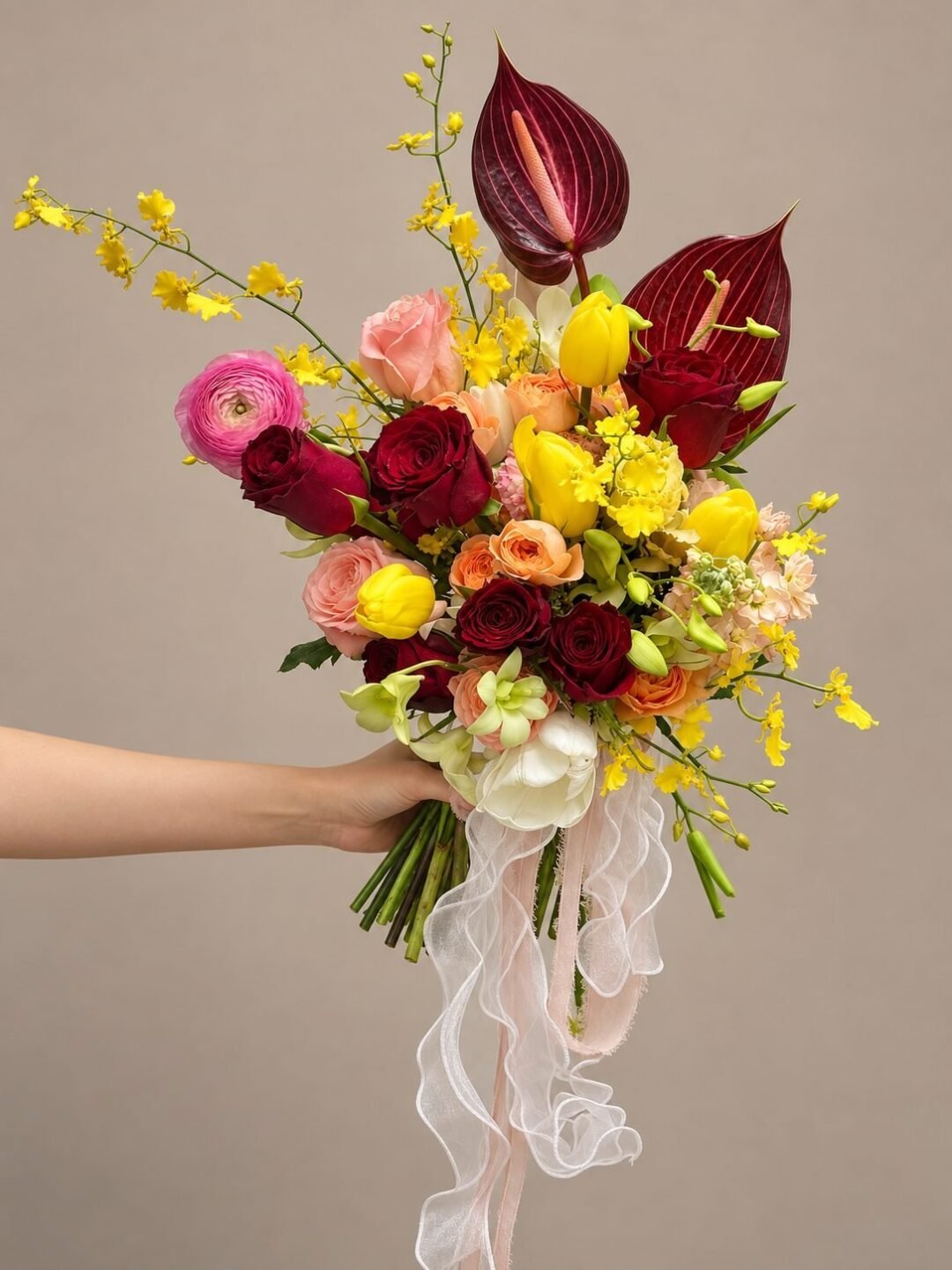 Mae dramatic · asymmetrical bridal bouquet in merlot, crimson, butter yellow, blush and ivory