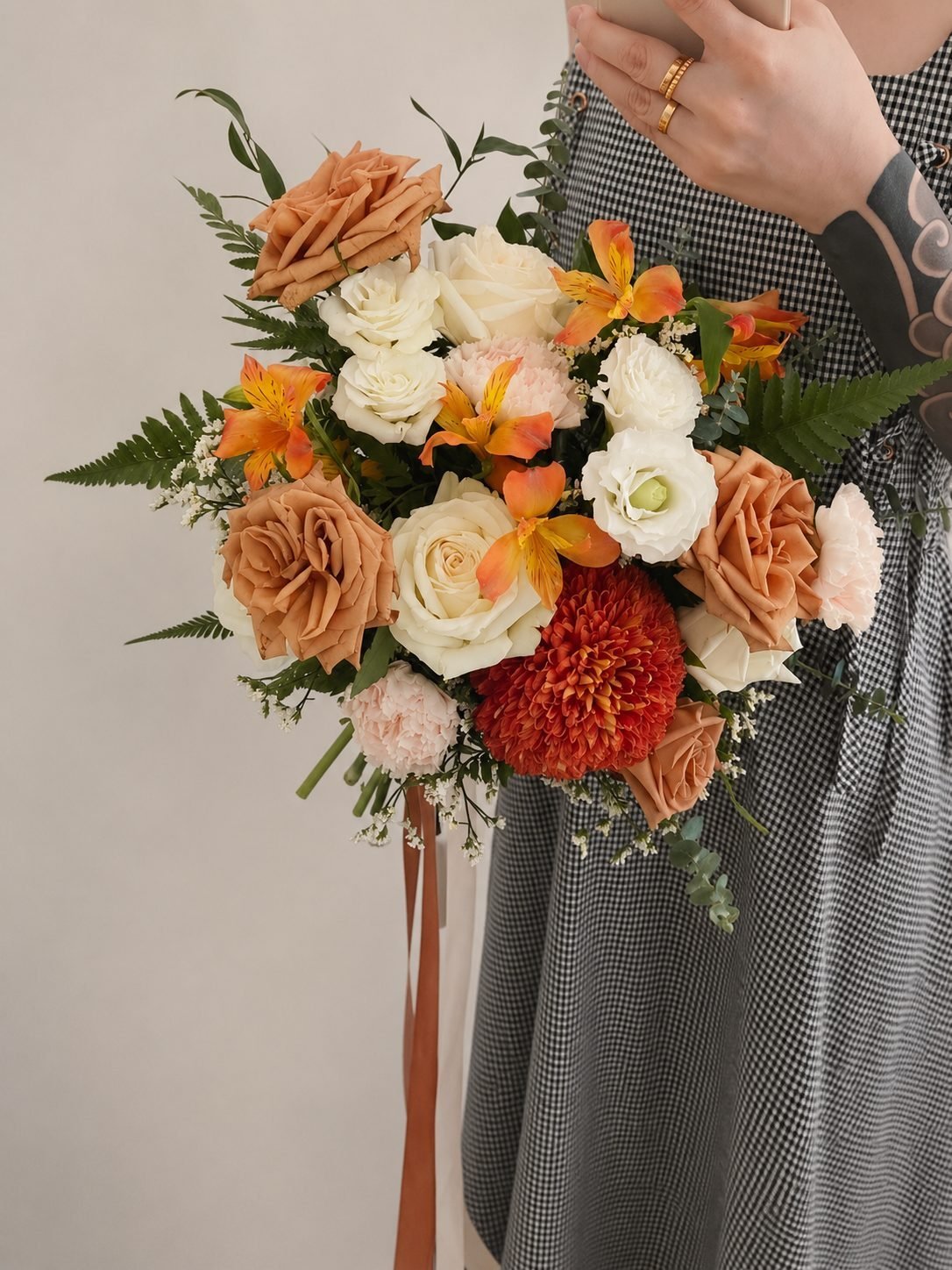 Mona garden inspired · asymmetrical bridal bouquet in ivory, toffee, blush, crimson and marigold — close-up