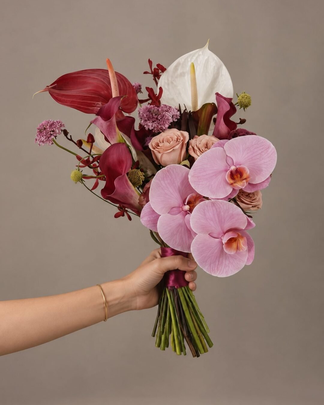 Zoie dramatic · cascading bridal bouquet in fuchsia, purple, crimson, ivory and fresh green